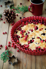 Cranberry Christmas tart decorated with stars and fresh cranberries 
