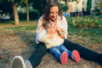 Mother and little daughter in a park