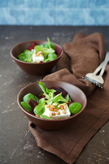 Corn salad with beetroot, feta cheese and decorated with nuts 
