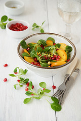 Fresh corn salad with persimmon and pomegranate 
