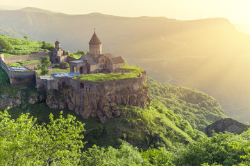 Ancient monastery in setting sun. Tatev. Armenia