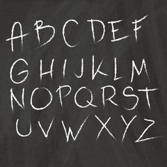 Fototapeta na wymiar Hand drawn alphabet on graphic background.Chalkboard style. Vector letters