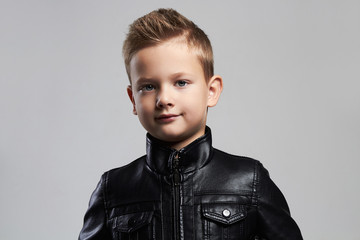 Fashionable child in leather coat.stylish little boy with trendy haircut