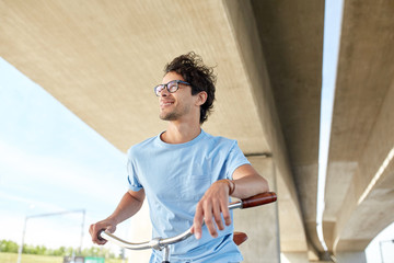 Fototapeta premium young hipster man riding fixed gear bike