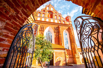 View from the gates on the beautiful Francis of Assisi gothic church in the old town of Vilnius city, Lithuania.