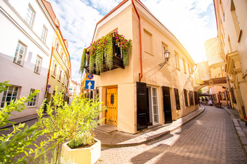 Fototapeta na wymiar View on the beautiful narrow pedestrian street in the old town of Vilnius, Lithuania