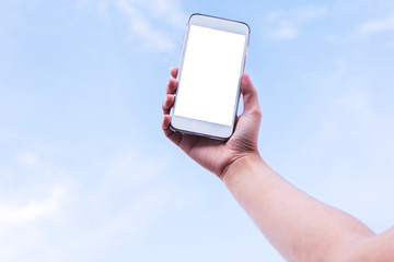 Hand to hold mobile phone on blue sky