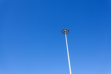 A football stadium sport light with blue sky