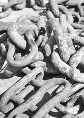 Rusty chain on a boat deck.