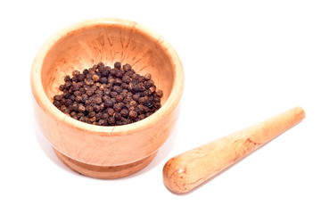 Mortar and pestle with black pepper seeds