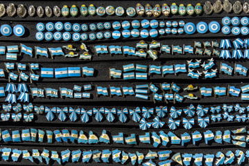 A lot of Argentine pins on black board at the Feria de Mataderos Fair sunday fair in Buenos Aires,...