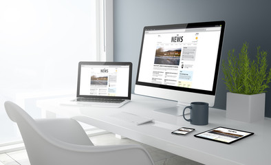 Fototapeta na wymiar grey studio devices with news website