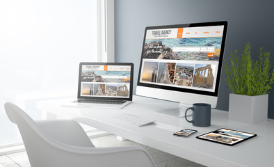 Fototapeta na wymiar grey studio devices with travel agency website