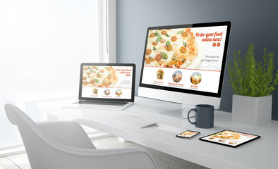 grey studio devices with modern design pizza website