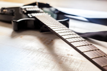 Fototapeta premium Electric guitar on old wooden surface