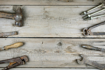 Old wooden desktop. Old rusty carpentry tools. Horizontal mockup