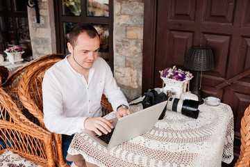 Man is looking at laptop with excitement.