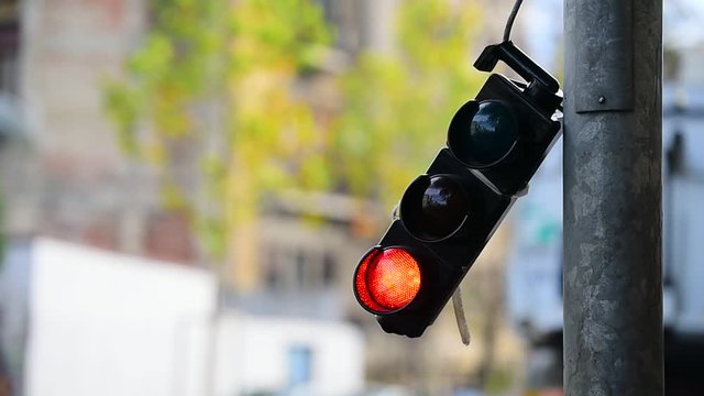 Broken traffic lights pole changing colors