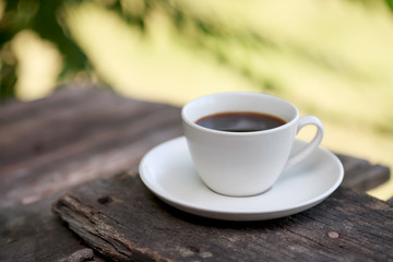 Cup of coffee on a wooden table