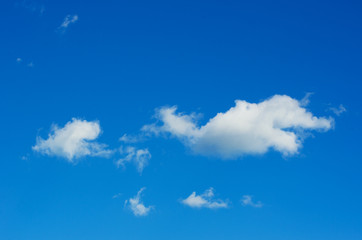 white fluffy clouds in the blue sky