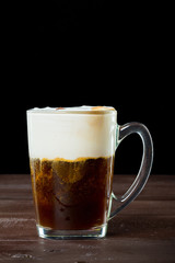 Irish coffee on the dark wooden background