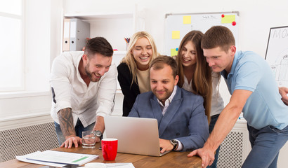 Fototapeta premium Happy business people team together look at laptop in office
