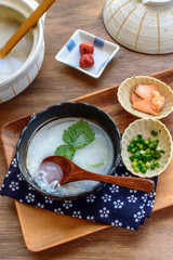 a bowl of Japanese rice porridge (okayu). Okayu is commonly served as winter dish in Japan.