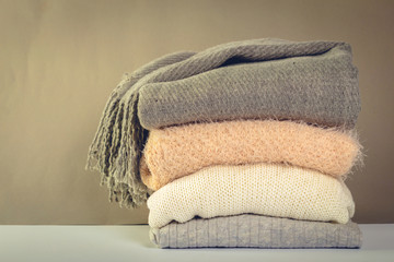 Stack of cozy knitted sweaters