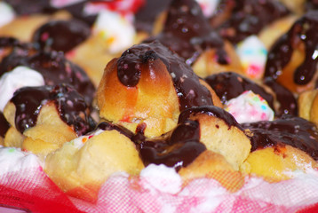 colorful french pastry with cream and chocolate sauce