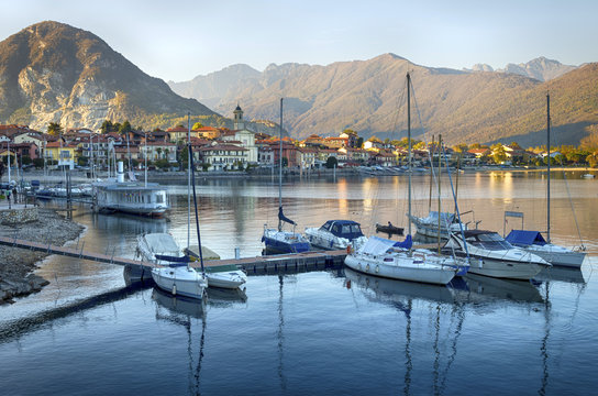 Lake Maggiore, Italy. Sunset Panoramic view of Lake Maggiore with yahts and passenger boats, Baveno near Stresa, Piedmont.
