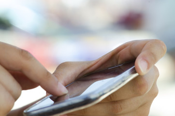 Close up of female hands and fingers using a mobile smart phone