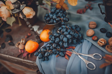 bunch of ripe grapes on a blue cloth
