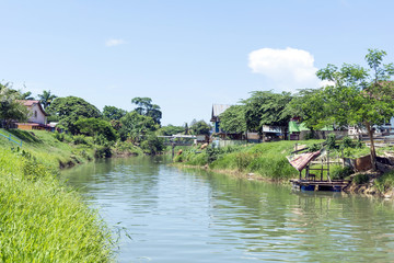 Fototapeta na wymiar Landscape of a river in a village