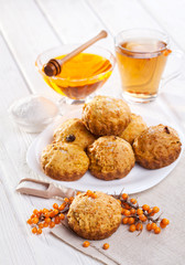muffins with tea and honey on the white background