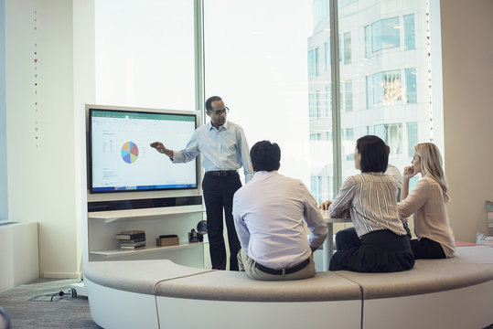 Business people listening to presentation