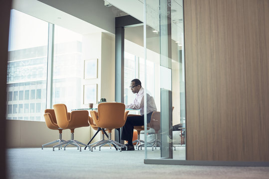 Businessman Working Alone In Office