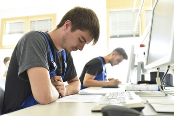 Vocational school students writing a test