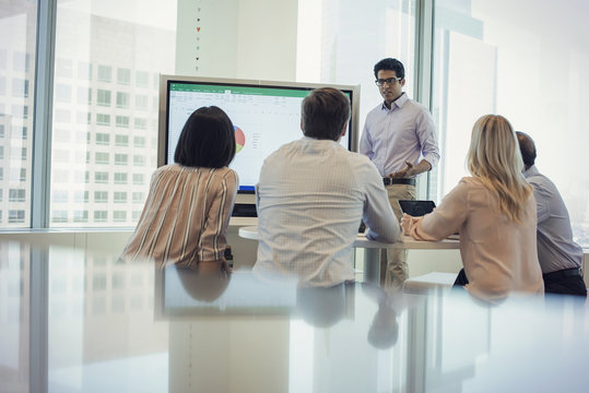 Business people listening to presentation
