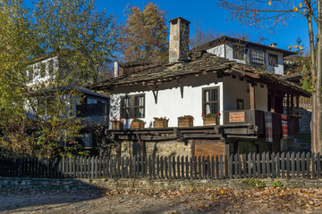 Fototapeta na wymiar Old house with wooden fence in village of Bozhentsi, Gabrovo region, Bulgaria