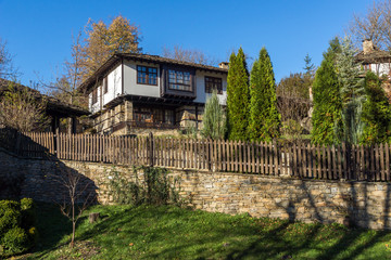 Fototapeta na wymiar Panoramic view with Old house with wooden fence in village of Bozhentsi, Gabrovo region, Bulgaria