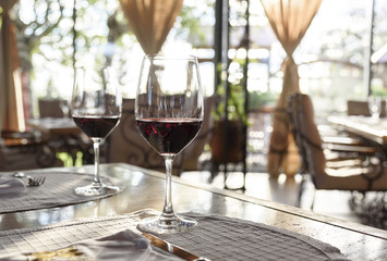 Restaurant table with red wine glasses