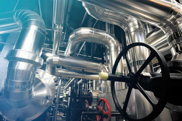 different size and shaped pipes and valves at a power plant