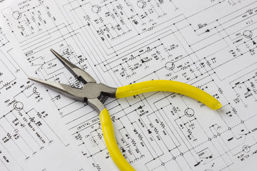 Electronics engineering drawing or circuit schematic with pliers