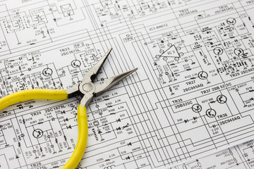 Electronics engineering drawing or circuit schematic with pliers
