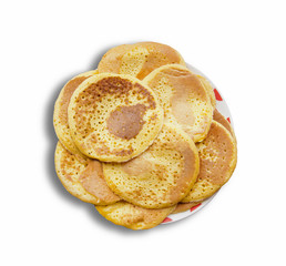 Stack of delicious pancakes on plate isolated