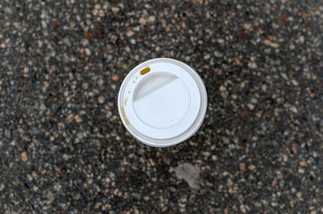 Young girl with a plastic cup of coffee