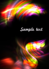 Abstract pattern with bright, multicolored trail on black background