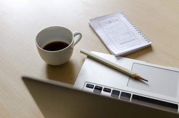 Laptop, sketchbook and pencil