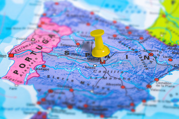 Madrid in Spain pinned on colorful political map of Europe. Geopolitical school atlas. Tilt shift effect.
