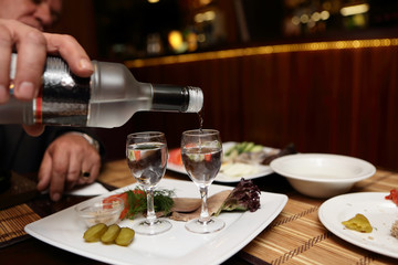 Man pouring vodka